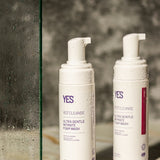 YES Cleanse Rose and Fragrance-Free Intimate Wash bottles in a shower