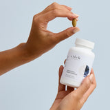 Hands holding Zilch Digestion + Bloat Formula and a tablet – Zilch Digestion + Bloat Formula 120 Tablets